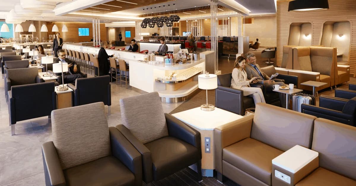 LuxShuttle private car service to American Airlines Admirals Club at Hartsfield-Jackson Atlanta — elegant lounge with modern furnishings
