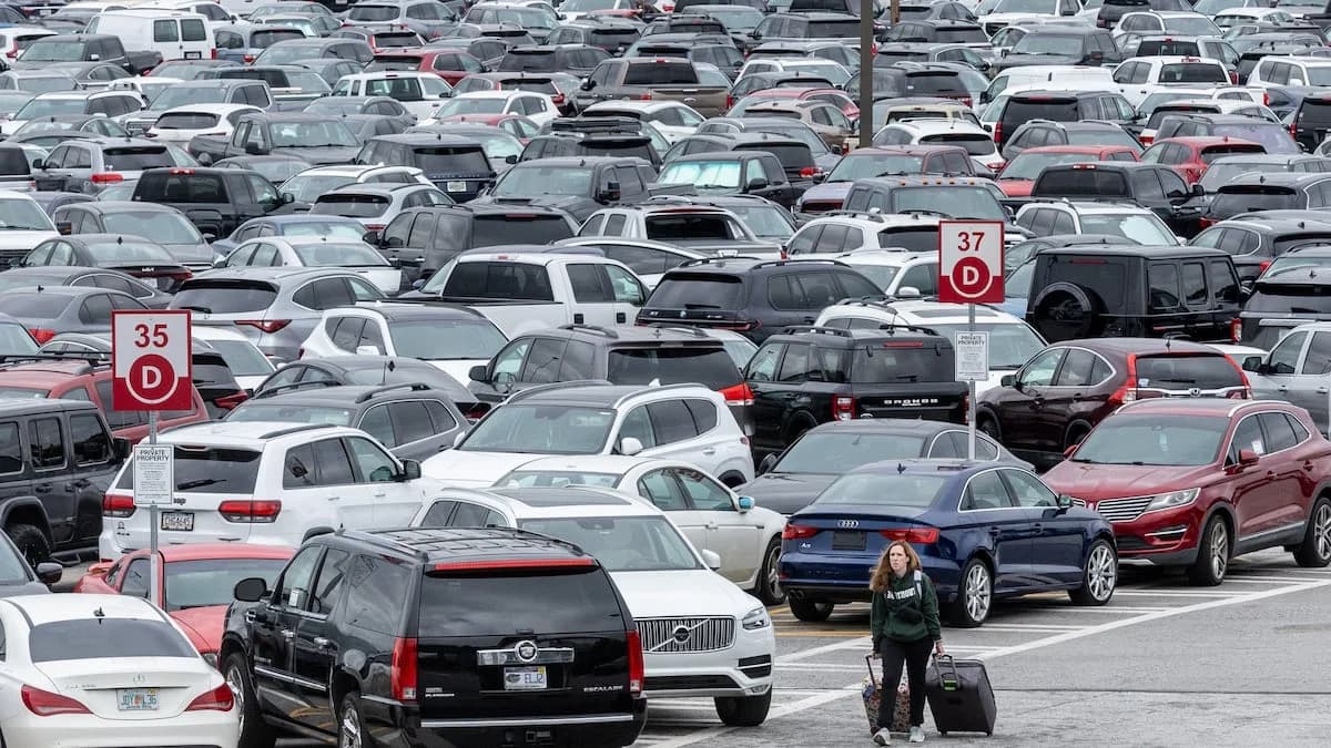 ATL airport economy parking lot — open-air surface lot with row markers at Hartsfield-Jackson
