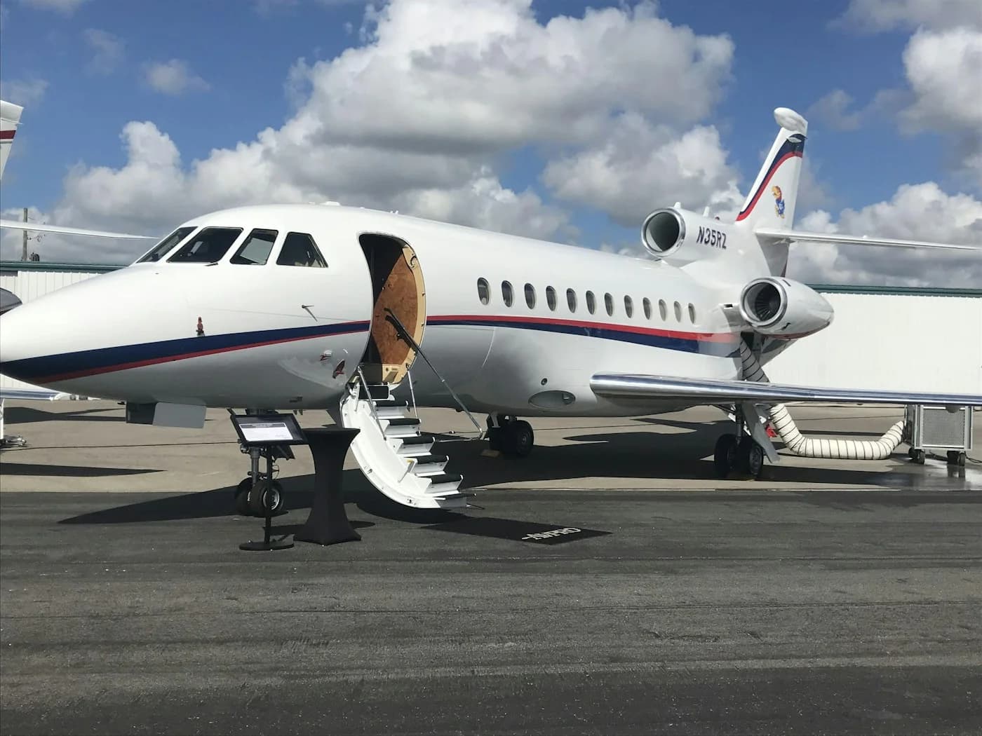 LuxShuttle corporate aviation transfer at Briscoe Field — private jet on tarmac at LZU Airport