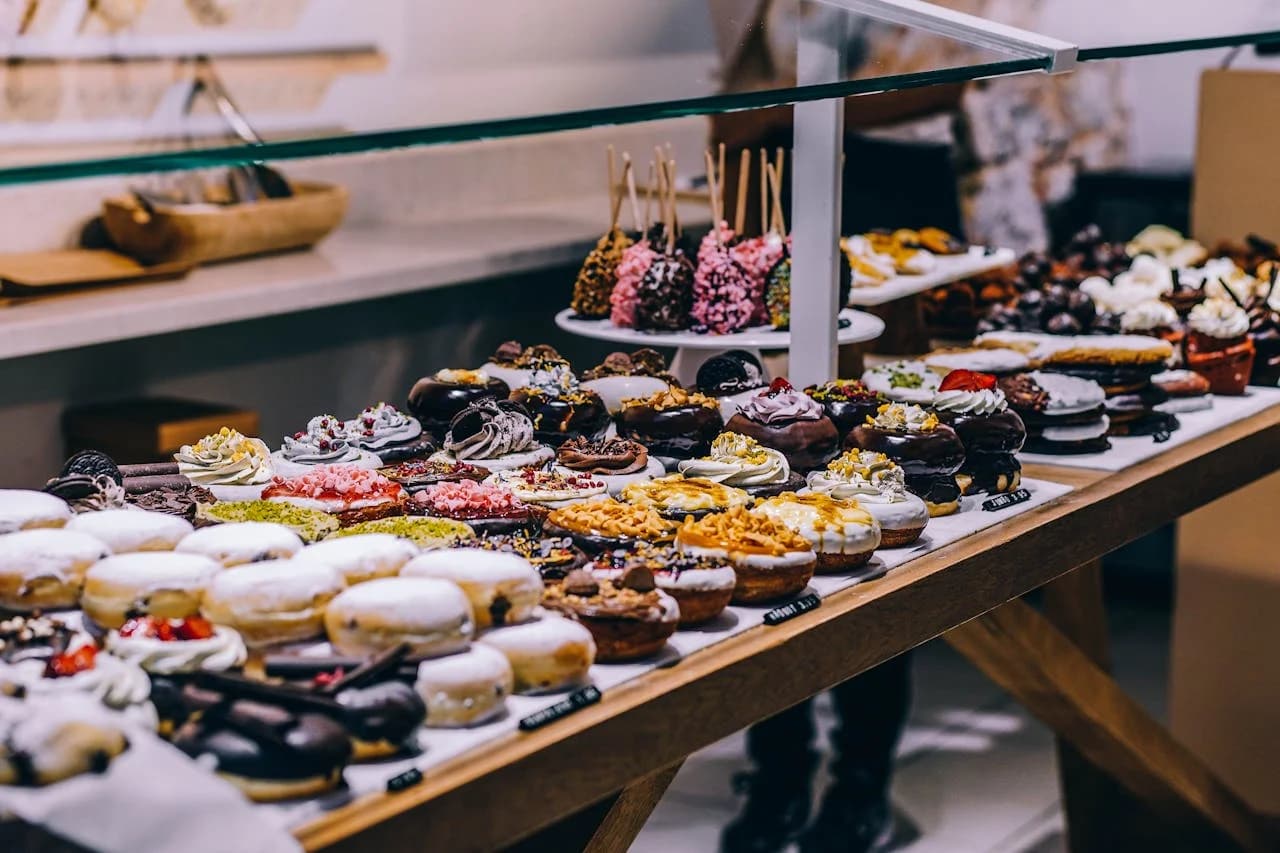 LuxShuttle private car service to Bread and Butter Bakery — fresh pastry display on the Covington square near CVC Airport