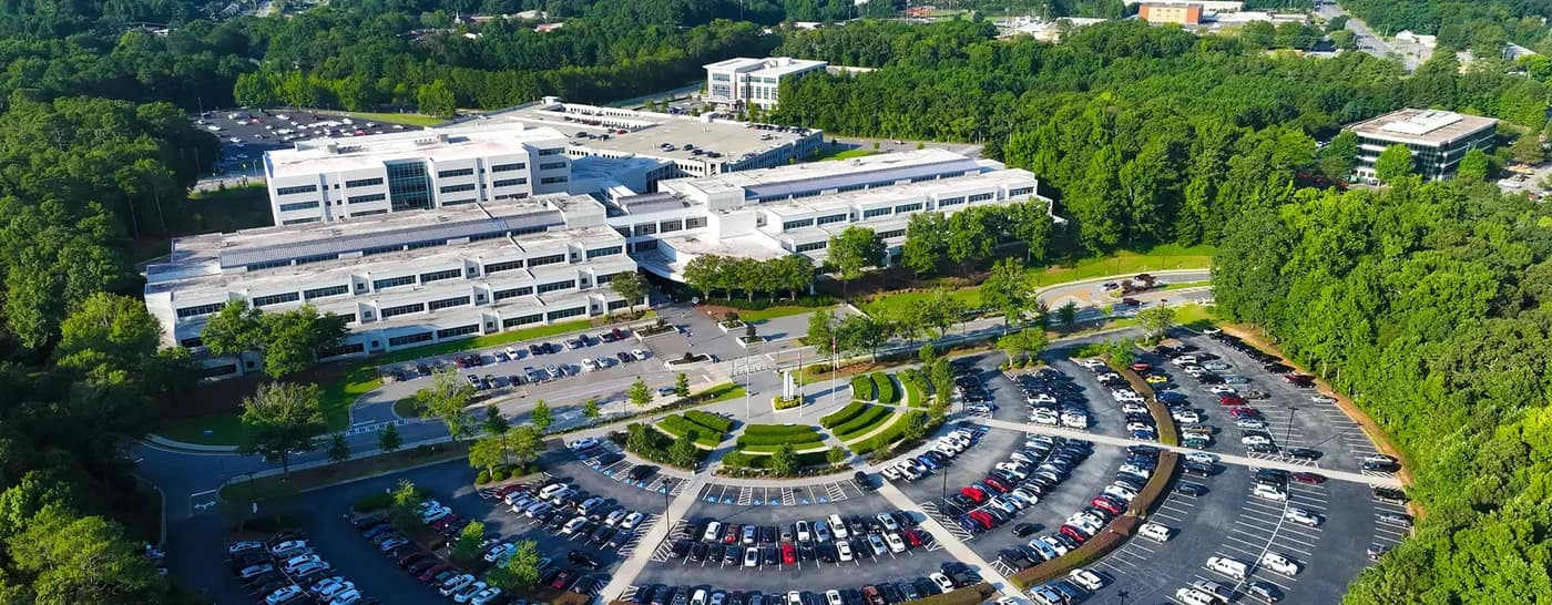 LuxShuttle private car service to Gwinnett County business corridor — modern corporate office near Briscoe Field