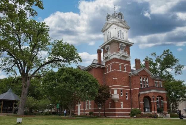 LuxShuttle private shuttle to Gwinnett Historic Courthouse — 1885 Romanesque Revival landmark on Lawrenceville Square