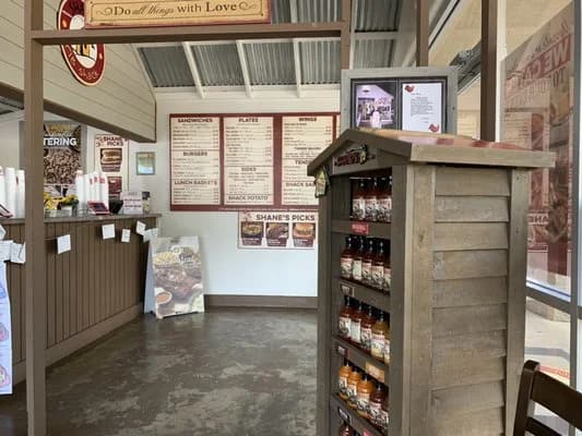 LuxShuttle private transfer to Shane’s Rib Shack — slow-smoked barbecue in Locust Grove near HMP