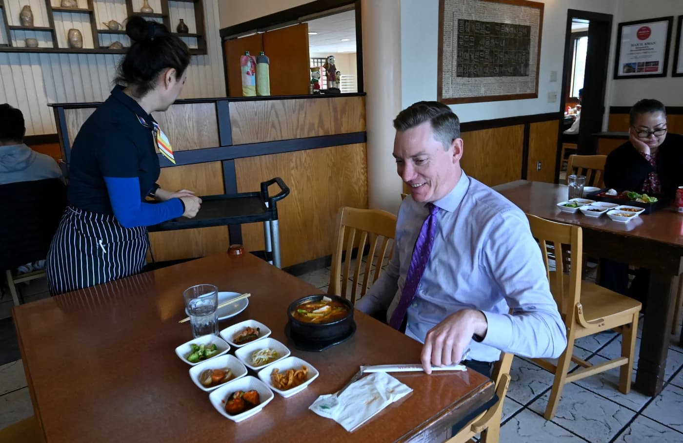 LuxShuttle private transfer to Han Il Kwan — Korean BBQ with traditional banchan on Buford Highway near PDK