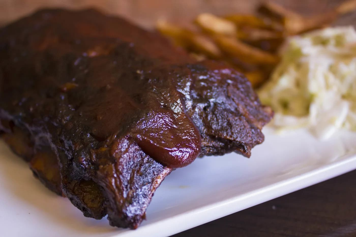 LuxShuttle private transfer to Stockyard Burgers and Bones — craft burgers and smoked meats on Marietta Square near RYY