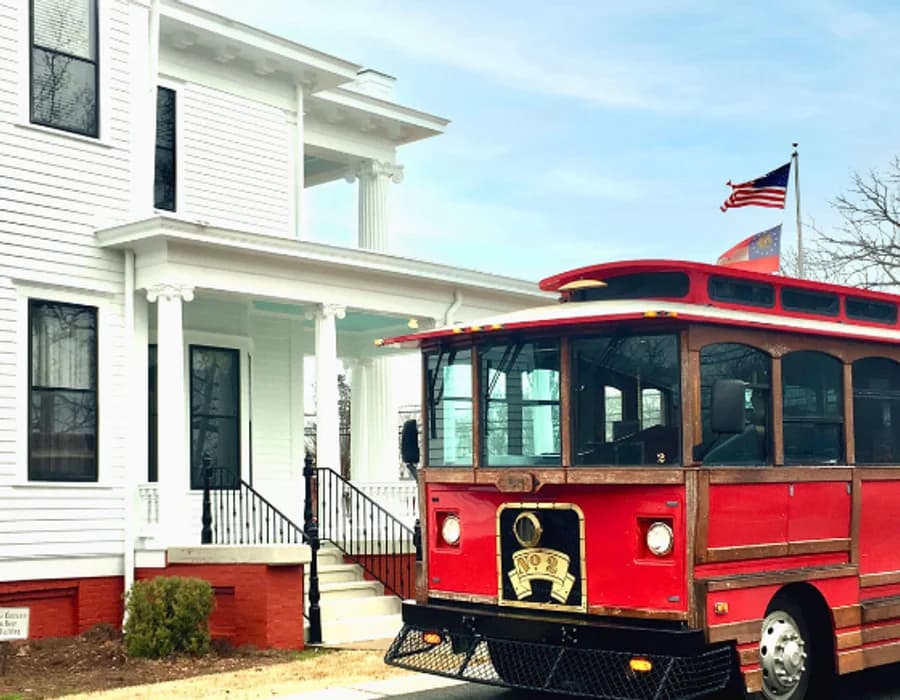 LuxShuttle chauffeur service to Braselton — historic trolley and town hall near WDR airport
