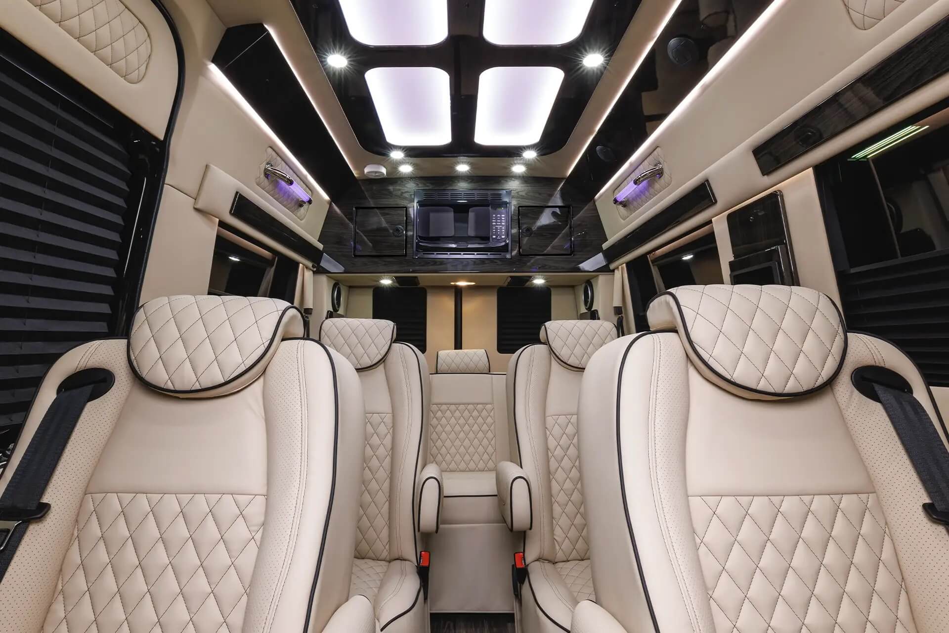 Cream quilted leather captain chairs inside LuxShuttle Mercedes Sprinter Atlanta