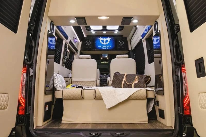LuxShuttle Mercedes Sprinter full cabin depth viewed through open rear doors