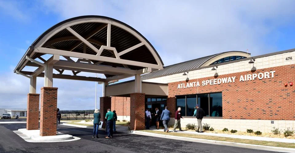 Henry County officials at the Atlanta Speedway Airport FBO terminal grand opening ceremony 2022