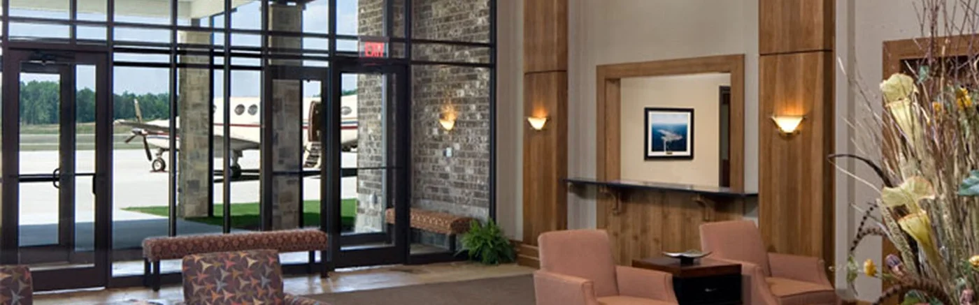 Paulding Airport FBO lobby with jet visible through windows