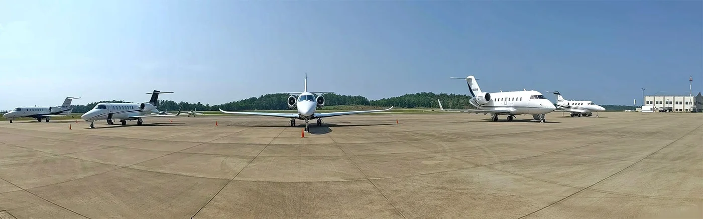 Private jets lined up on Paulding Airport ramp