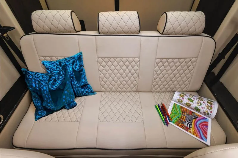 LuxShuttle Mercedes Sprinter cream leather interior compared to rideshare vehicles