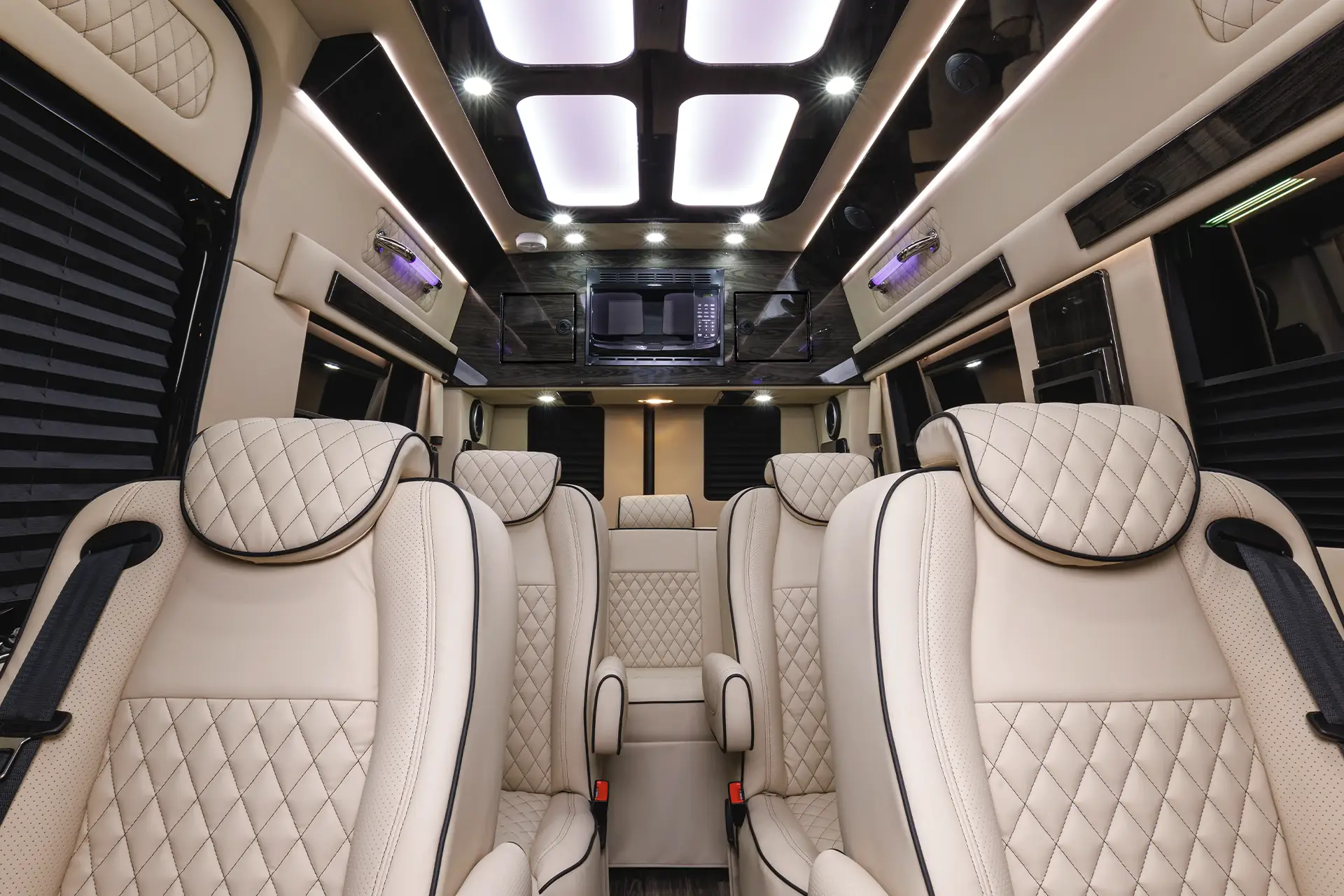 LuxShuttle Mercedes Sprinter captain chairs — private car service alternative to taxi